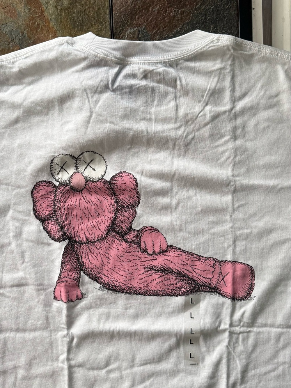 KAWS White T-Shirt with Pink XX Graphic